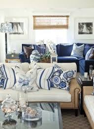 Here's another beautiful room with lighter walls and rich navy accents. How To Add Color If You Re Afraid To Use Color Tidbits Twine Blue And White Living Room Coastal Decorating Living Room Living Room White