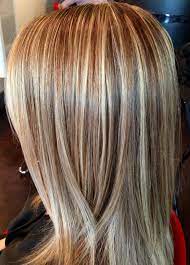 It's no secret that silver and gray pair beautifully. This Beautiful Hair Color Was Created By Foiling The Top Of Head In A Diamond Section And Alternating Light Golden Blonde Hi Blonde Hair Color Hair Styles Hair