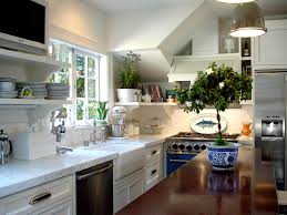 The white beadboard planks were applied at a small square tray ceiling area at the center of the kitchen and was framed with wood cornice for accent. Kitchen Ceiling Ideas