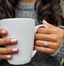 Carefully encrusted 0.26ct diamonds across the hidden halo and delicately tapered band create an air of sophistication. What Is A Hidden Halo Engagement Ring Adiamor
