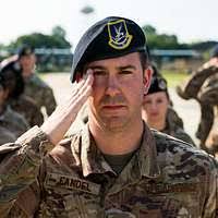 Chief Information Specialist Technician Dwayne Peterson fits a combination  cover