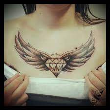 The lotus flower is most often connected to spirituality, especially as a sacred symbol within asian cultures. Great Diamond With Wings Tattoo Designs On Chest Wings Tattoo Diamond Tattoos Trendy Tattoos