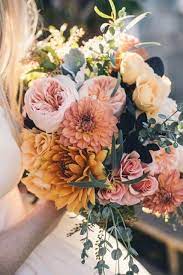 If you're planning an autumn wedding, chances are you already have your ideal autumn wedding colors in mind. Wedding Flower Inspiration Autumn Colors Dahlias Wedding Bridal Bouquet Fall Red Bouquet Wedding