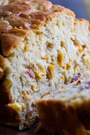 They sweated onions, shallots, and/or scallions, then mixed them, along with the cubed cornbread, into an egg and light cream custard, baking in a rectangular pan. Bacon Corn Bread Simply Delicious