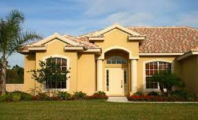 This beach house color scheme mimics the color of the ocean. Painting Stucco Paint Gurus House Paint Exterior Exterior House Colors Stucco Exterior