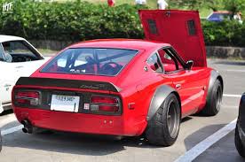 Heres the datsun 240z painted in red with ferrari stickers on both the sides. Red 240z Datsun Car Nissan Z Cars Datsun