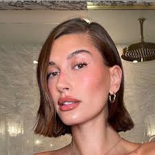 Hailey Bieber shows off her teeny waist in leather mini-skirt and crop top  for new photo during NYC fashion week