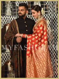 Anushka Sharma In Red Sabyasachi Banarasi Saree And Virat Kohli In Black Sabyasachi Bandhag Indian Groom Wear Wedding Dresses Men Indian Indian Wedding Outfits Anushka sharma (pronounced əˈnʊʃka ˈʃərma;