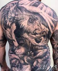 A Lion With Wings Fighting The Evil Demons Mens Full Back Piece Showing Good Will Always Prevail Over Evil Animal Tattoos Black Tattoos Back Tattoo