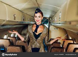 Flight Attendant. Attendant. Cabin Crew. Beautiful Stewardess. Air Hostess.  Woman And Commercial Plane. Charming Stewardess. Flight Attendant Uniform.  Stock Photo By ©Tverdohlib.com 310399658
