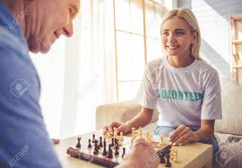 Maybe you would like to learn more about one of these? Beautiful Young Girl Volunteer And Handsome Old Man Are Playing Stock Photo Picture And Royalty Free Image Image 63889181