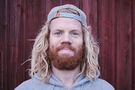 Portrait Of A Man With A Red Beard Blue Eyes And A Cap A Portrait Of A Young Outside Working Man With A Large Red Beard And Long Red Beard Blonde