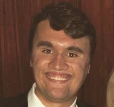 Charlie Kirk: Capital gums, lowercase teeth.