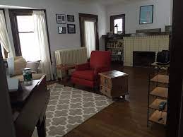 In a large living room with lots of windows, arrange furniture front and center. Layout For An Awkward Small Living Room