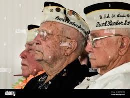 Pearl Harbor survivors, John Rauschkolb, 92, George Larsen, 94 and Clarence  Bayal, 91 during the ceremony at Coast Guard Station Alameda, Calif.