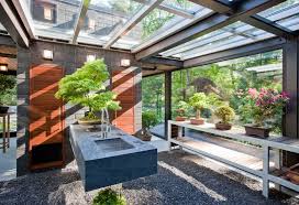 A Glass House In The Garden Glass House Garden Design Magazine Luxury Garden