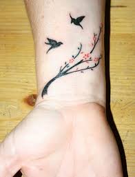 Wrist tattoo with butterfly and heart. 50 Cute Small Wrist Tattoos For Girls Small Wrist Tattoos Wrist Tattoos Girls Wrist Tattoos