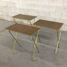 Set of folding metal tv trays, (4pcs), vintage 80s, tv table, snack tray, forrest, nature, dining&serving, jeanniesvintagejems 4.5 out of 5 stars (86) $ 322.25. Vintage Tv Trays Retro 1960s Mid Century Modern Set Of 3 Matching Woodgrain Laminate Gold Metal Collapsible Tables Mcm Living Room Decor By Retrospectvintage215 From Retrospect Vintage Of Philadelphia Pa Attic