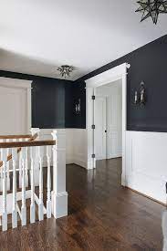 Turn Up Your Decor With These Mesmerizing Lighting Fixtures From Modern Lamps To Ceiling Lights Your Modern Home Decor Wil Black Walls Home White Wainscoting