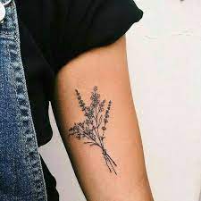 A bouquet of flowers is a perfect tattoo idea. Pin By Melisa On Tattoos Simple Arm Tattoos Tattoos Small Tattoos