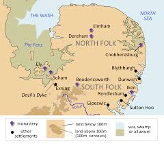 A helmet, sceptre, sword, hanging bowl, bowls and spoons, shoulder clasps, a belt buckle, and purse lid. Sutton Hoo Wikipedia