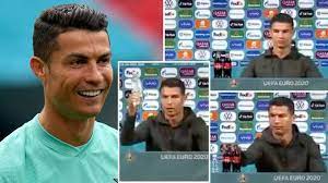 Cristiano ronaldo removes bottles of coca cola from press conference table. Cristiano Ronaldo S Reaction To Coca Cola Bottles At Portugal S Euro 2020 Conference Is Priceless