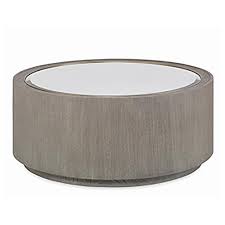 Round mirror coffee table should always look refreshing, unique and elegant, as that is where you would sit for a fresh cup of coffee and feel rejuvenated. Tomes Round Mirror Coffee Table Luxe Home Company