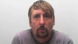 Burglar caught hanging upside down