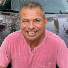 What is the error in L'Anse Creuse Public Schools' printed material?