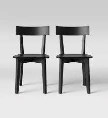 Whether it makes up the majority of the frame, or is simply used as an accented detail, wood adds a warmth and character to dining and kitchen chairs like no other. 30 Dining Chairs That Make A Statement Black Dining Chairs Modern Modern Dining Chairs Dining Chairs