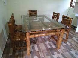 Four armless chairs offer comfortable seating. Bamboo Dining Table Set Kerala Responsible Tourism Network