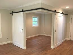 Created A Versatile Space In An Open Room With Barn Doors Basement Remodeling Home Remodeling Basement Design