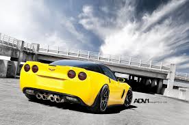 Screaming Yellow Chevy Corvette With A Black Top And Adv1 Custom Wheels Sports Car Wallpaper Corvette Chevy Corvette