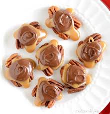 1 package kraft caramels · 1 tablespoon water · 1 cup pecans · 2 bags semi sweet chocolate chips · 1/2 bar paraffin wax. Caramel Pecan Turtles Candy Recipe Creations By Kara