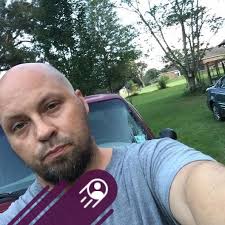 Indian Larry wears his Brooklyn tuxedo, Lake Ponchartrain, New Orleans  2003. I donated a 24x36-inch copy of this photo to the children's cancer  charity, to be auctioned off at the Mecum Auctions: