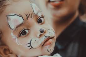 Start off by wetting your brush and getting some pink on it. 4 Animal Face Painting Design Ideas For Your Kids