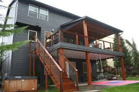 Second Story Deck With Cover For Ground Floor Suite Addition Of Tall Backuard Hedges To Block Neighbour S Patio Deck Designs Deck Remodel Building A Deck