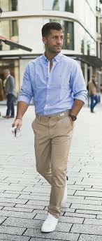 Kosta Williams With A Blue Button Collar Shirt With Rolled Up Sleeves Khaki Pants Brown Leather Banded Wat Mens Outfits Sneakers Outfit Men Pants Outfit Men