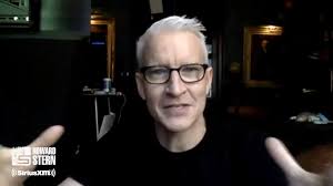 Anderson Cooper just had his first cup of coffee while working at CNN. He  tells Howard he had no idea how the office coffee machine worked and  struggled for 10 minutes to