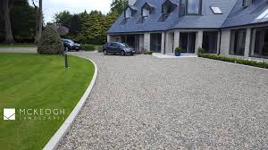 A garage door is concealed with flush hardwood cladding. Driveway Limerick Driveway Clare Driveway Ideas Driveway Design