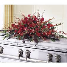 The orchid, long a celebrated symbol of love, wisdom, and beauty, enhances this austere and glorious funeral service focal point. Fresh Casket Sprays Funeral Casket Arrangements For Memorial Services Kremp Com