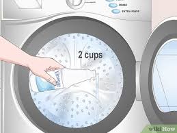 The exact method will vary slightly by machine model and type, especially depending on whether you have a front loader and a while the vinegar is sitting in the machine, dip a clean microfiber cloth into the water and use it to clean the outside of the machine. How To Clean A Smelly Washing Machine 10 Steps With Pictures