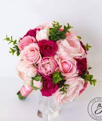 Find this pin and more on wedding flowers by susan winsor. Blush Pink And Fuchsia Roses Real Touch Flowers Bouquet The Bridal Flower Silk And Real Touch Wedding Bouquets Real Touch Wedding Bouquet Wedding Bouquets Pink Bridal Bouquet Flowers