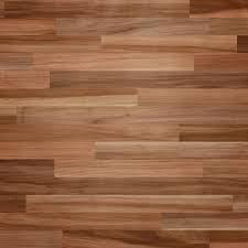 A large, contemporary living room with floor to ceiling windows and neutral toned hardwood floors is finished up with blue accent cushions. Hardwood Flooring Patterns A Guide Classic Floor Designs