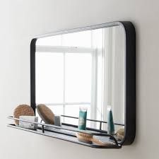 We love this vanity mirror because it brings rustic character to any wall, while its black matte metal mount makes for a fresh take on a classic farmhouse look. Metal Mirror With Storage Shelf Large Shades Of Light