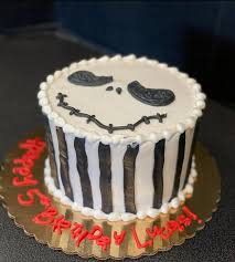 This festive jack skellington cake is a two tier cake that features jack skellington on the top of the cake. Jack Skellington Cake Starry Night Bakery