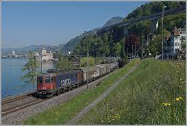 Shops and services at the station. The Sbb Re 620 061 2 Gampel Steg With A Cargo Train By The Castle Of Chillon Rail Pictures Com