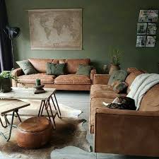 Looking at home in a mid century modern living room, a ruddy. Pin By Leann Raz On Interieurs Brown Living Room Living Room Green Living Room Colors