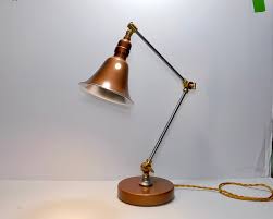 Their clean lines, shapes, and rich woods combine to work with minimalist decor as well as more traditional spaces. Mid Century Desk Lamp Industrial Deco Lamp Copper And Steel Lamp
