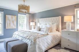 Gold lamps, gold beds, gold wall decor, gold accessories, gold pillows, gold frames, gold wall paper. White And Blue Bedroom With Gold Leaf Pendant Transitional Bedroom
